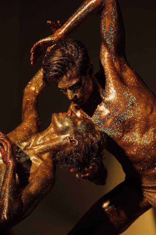 Free Models Covered in Shimmering Body Paint Stock Photo