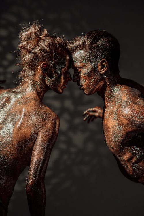 Free Man and Woman with Glitters on Body  Stock Photo