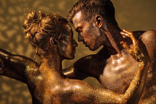 Man and Woman Covered with Glitters Dancing