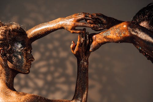 A Man and a Woman Posing as Bronze Statue