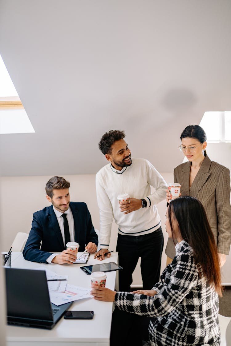 Businesspeople Having Coffee Break At Work