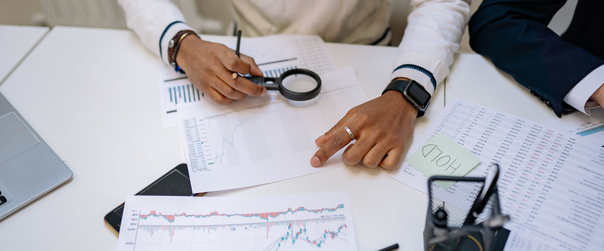 Professional reviewing financial charts and business reports in an office