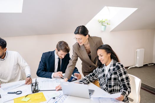 Colleagues collaborating in a modern office during a daytime meeting.