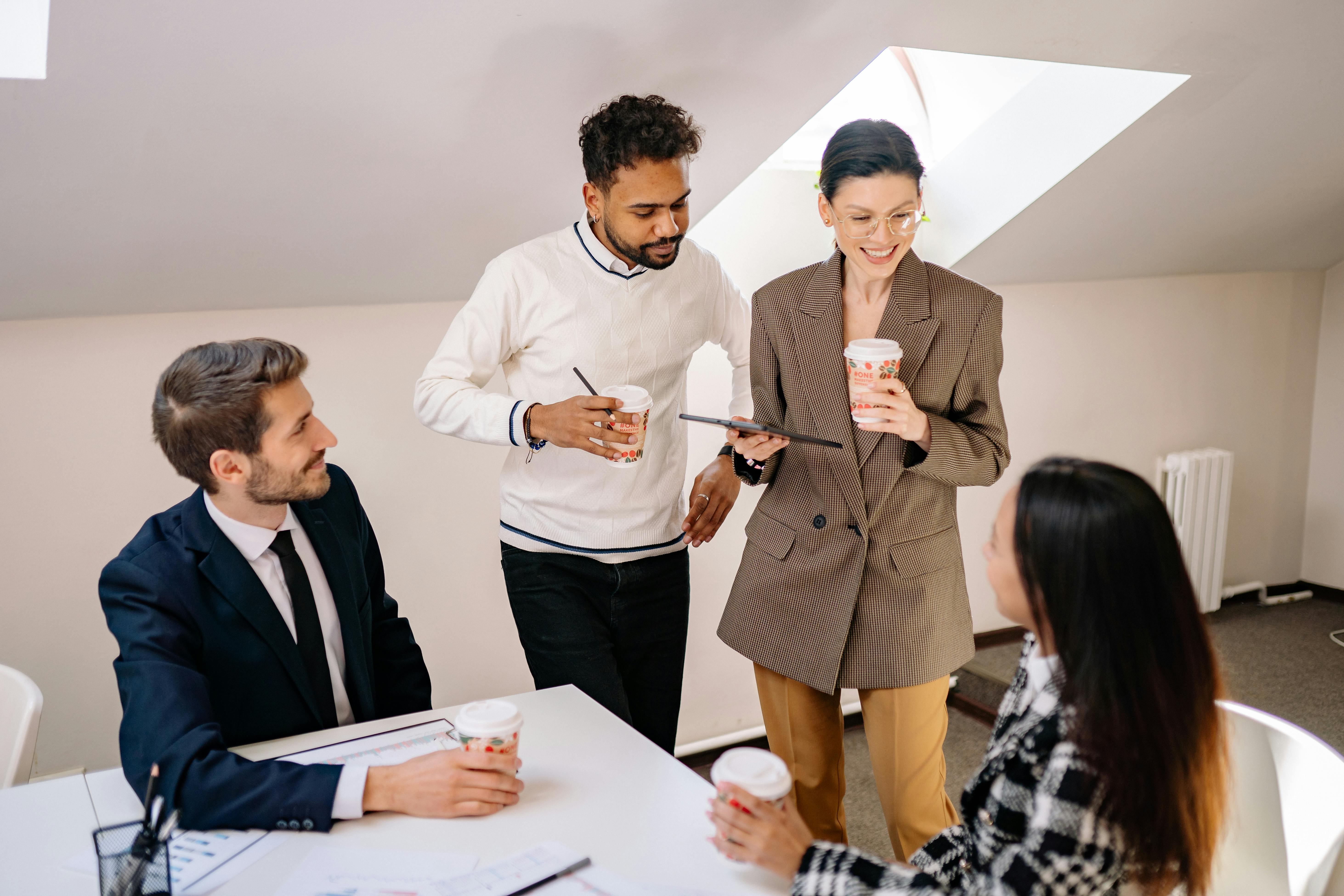 Smiling Young People Coworking in Office · Free Stock Photo, image size:1125x750