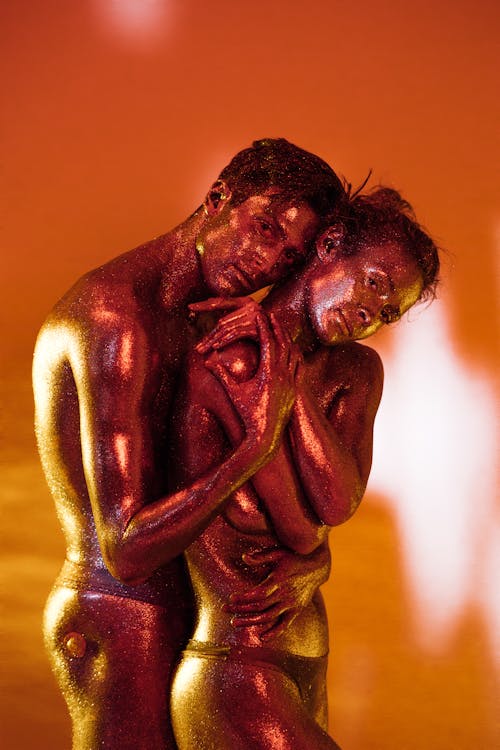Naked Couple Posing as Bronze Statue