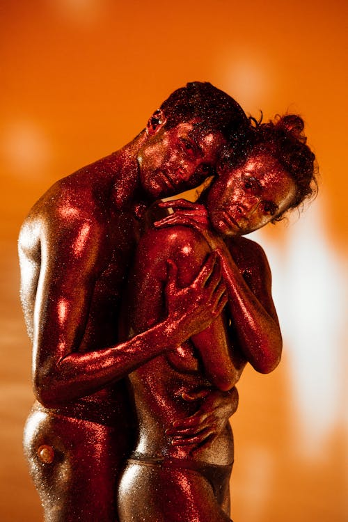 A Nude Man and Woman Filled with Oil Hugging