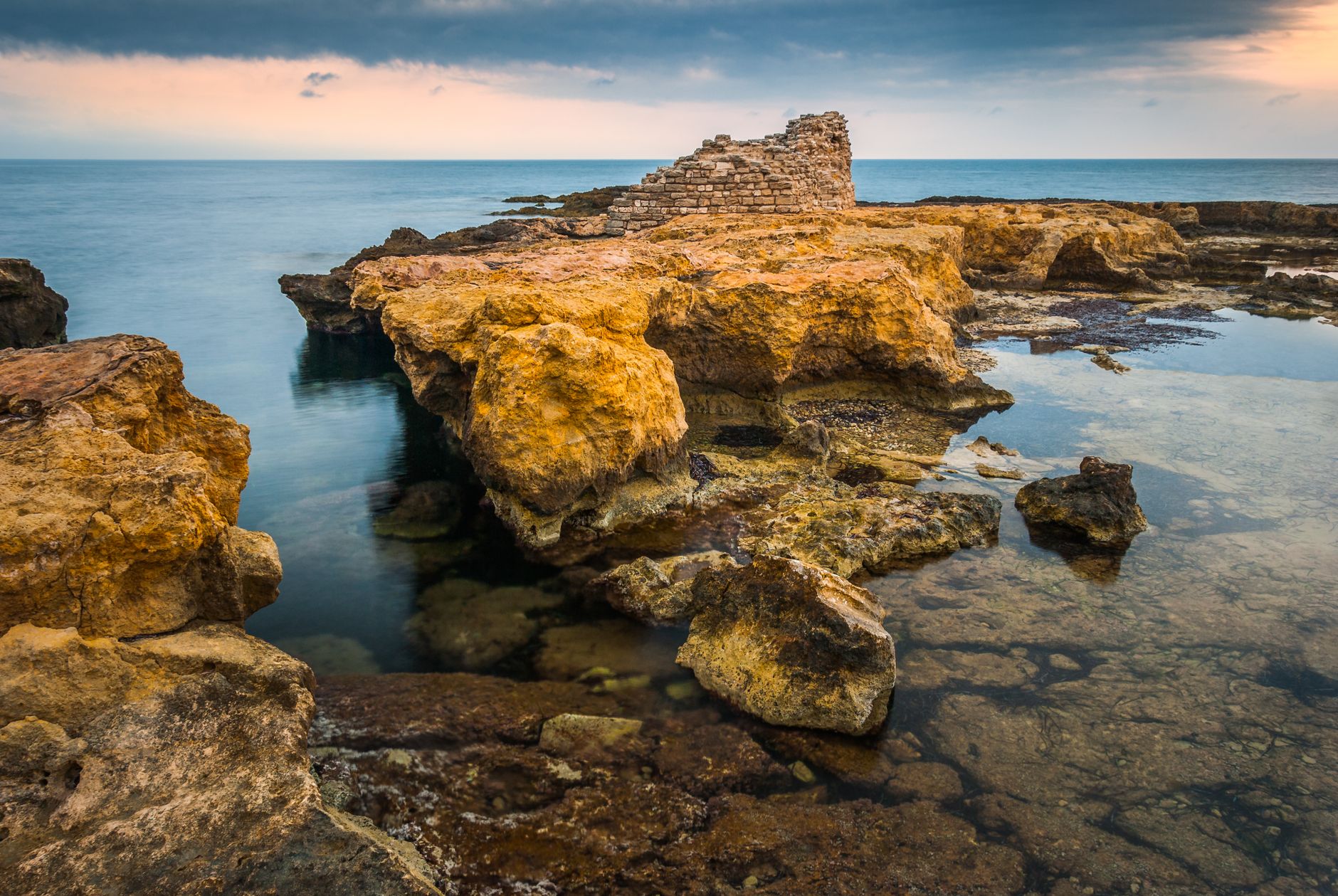 The Venetian watchtower and low coastline at Perivolia near Kiti south of Larnaca