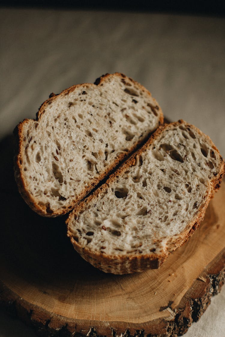 Slices Of Bread On Wooden Board