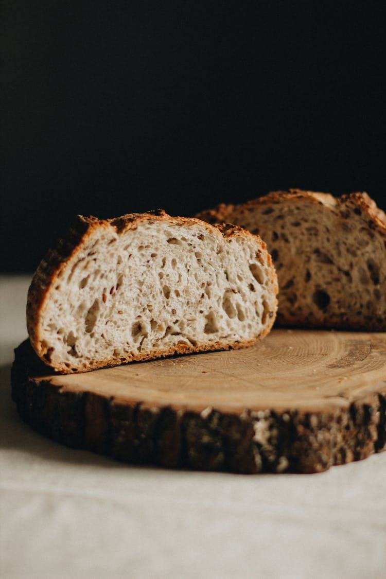 Slices Of Bread On Wooden Board