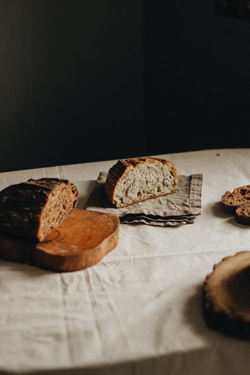 Free Cut loaves of bread on table Stock Photo