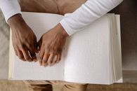 Person in White Long Sleeve Shirt Holding White Paper