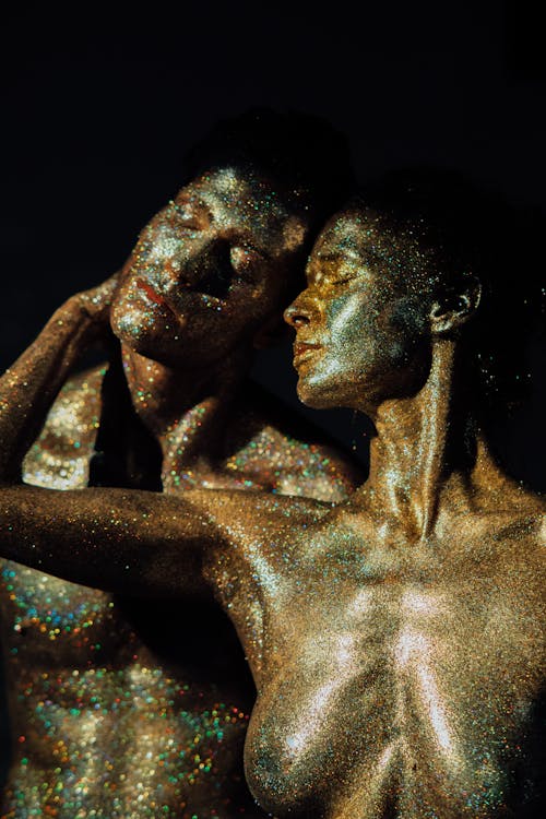 Topless Man and Woman Covered with Glitters
