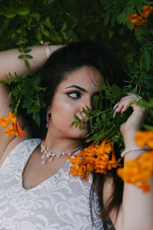 A Model Posing with Flowers