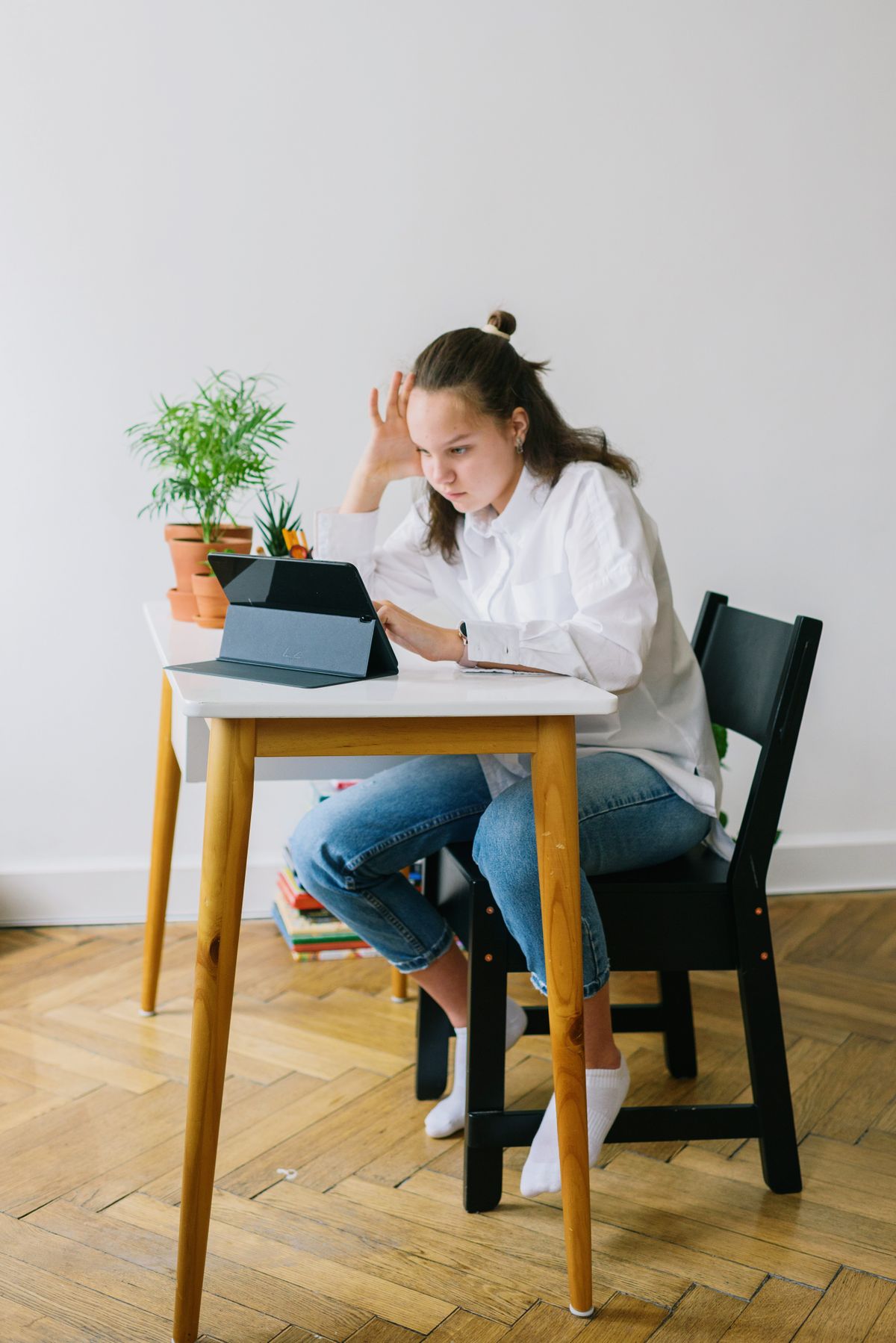 Teenage learner studying independently at home in a calm workspace