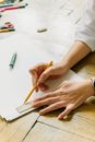 A Person Tracing a Line on a Paper