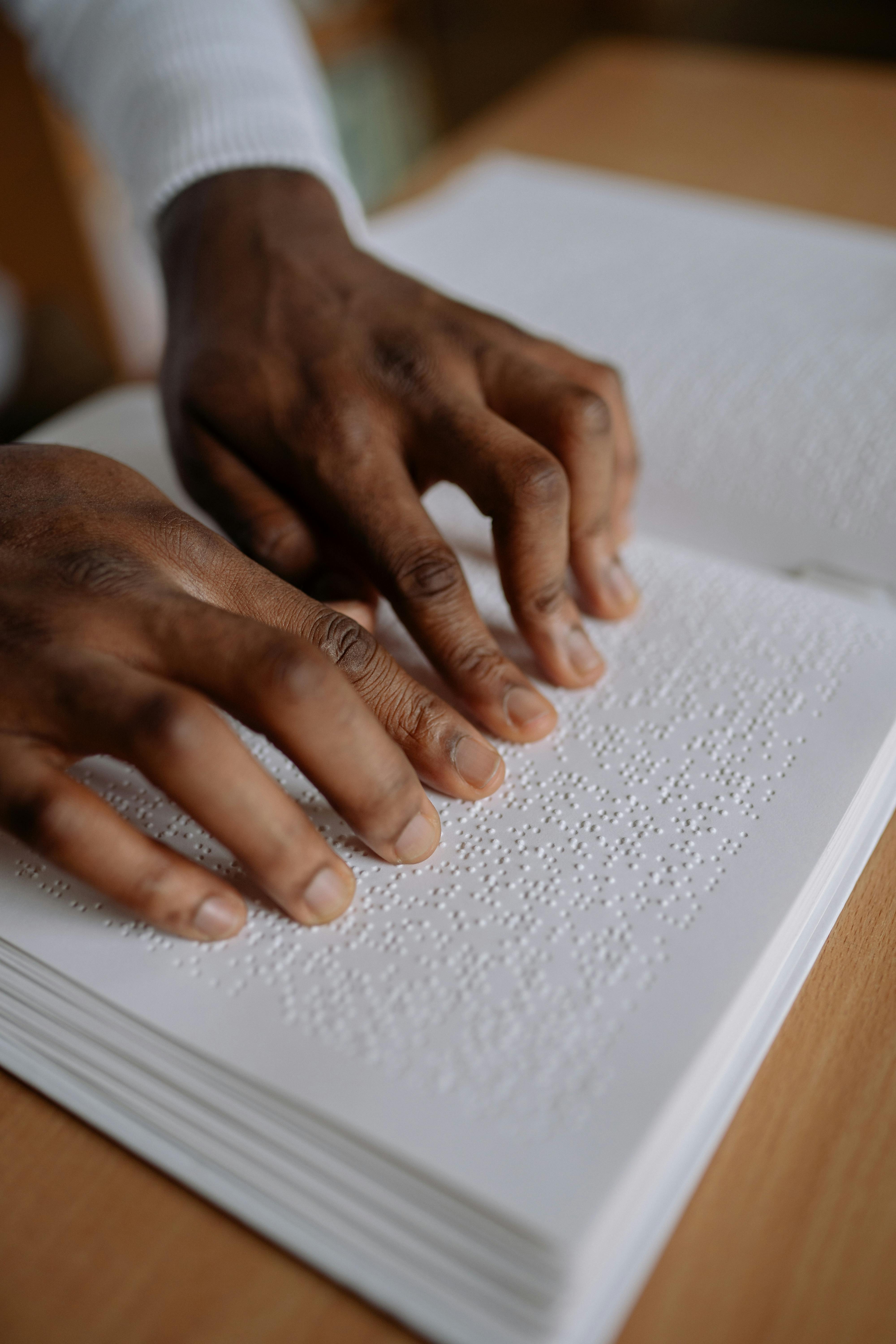 person holding a white book