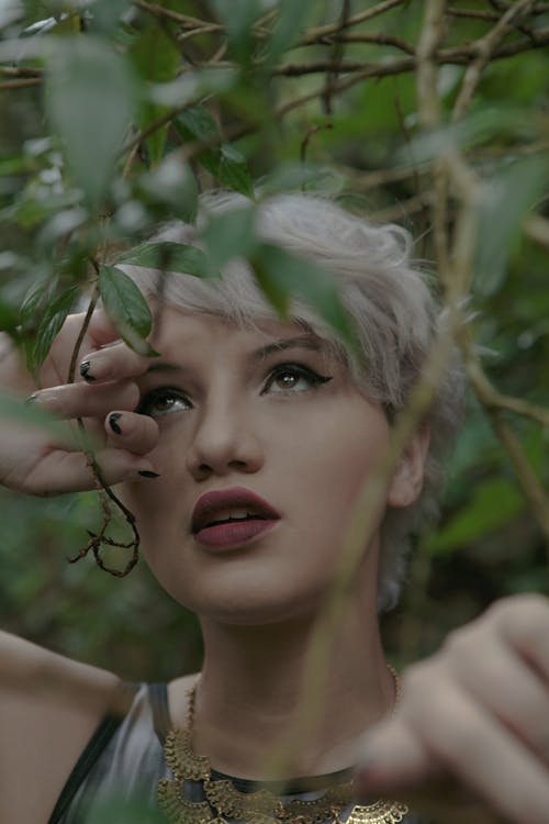 Woman Face among Leaves