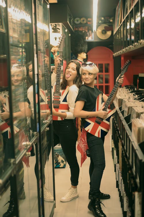 Women Posing with Guitars