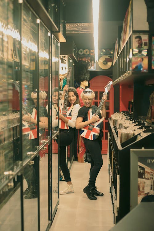 Women Standing with Guitars