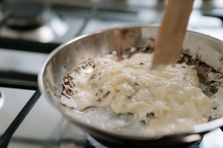 White Creamy Sauce In Stainless Steel Bowl