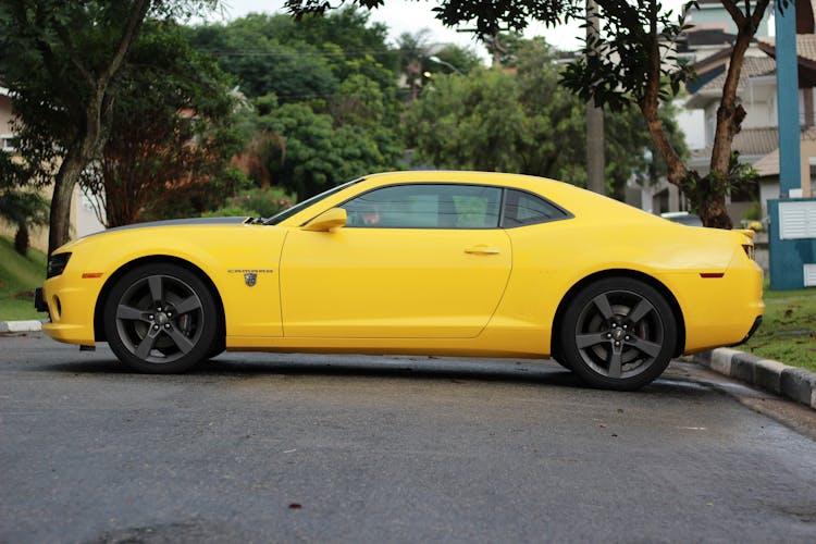 Side View Of A Yellow Camaro