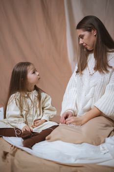 Woman in White Dress Shirt Sitting Beside Woman in White Dress Shirt