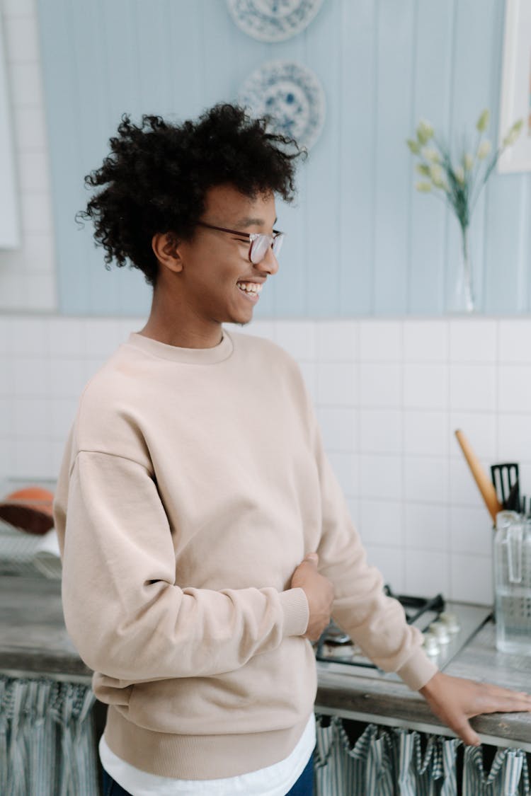 Man In Beige Sweater Wearing Eyeglasses Smiling 