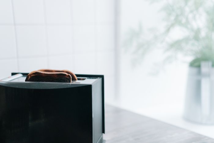 Toast rising from a slim toaster — photo by cottonbro studio on Pexels