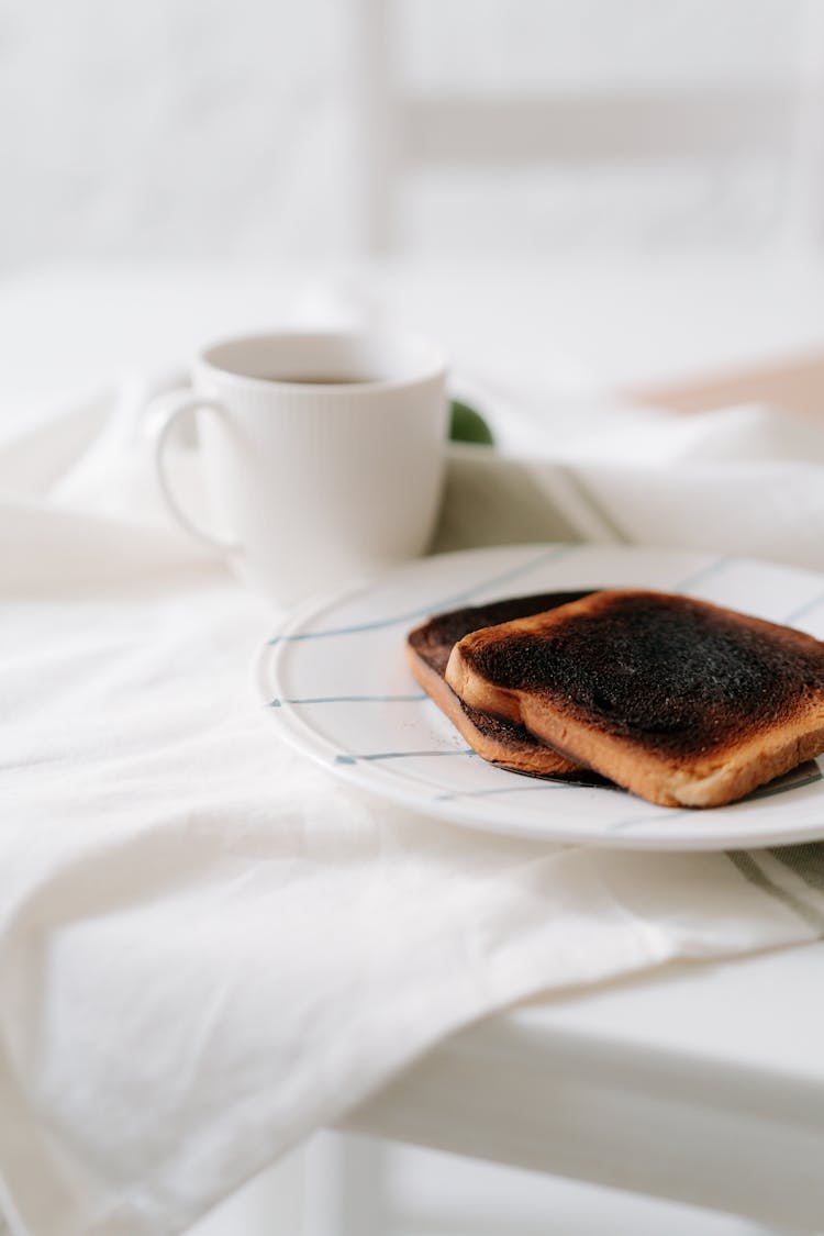 Toasted Breads On Plate Near Coffee Drink 