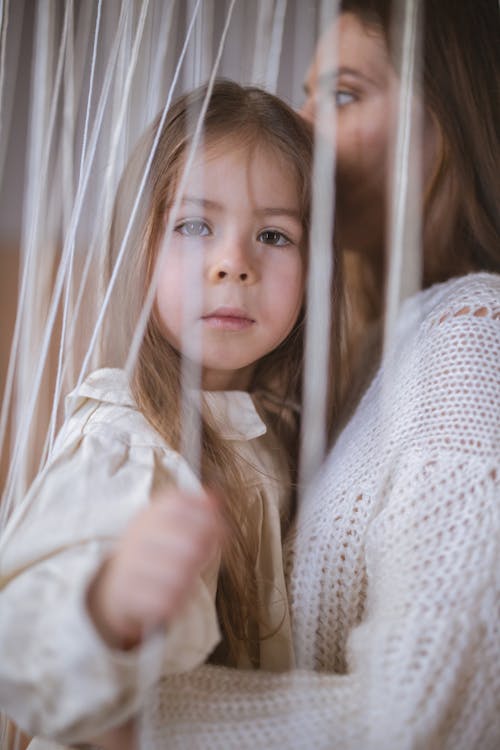 Free Close-Up Shot of a Woman Carrying Her Child Stock Photo