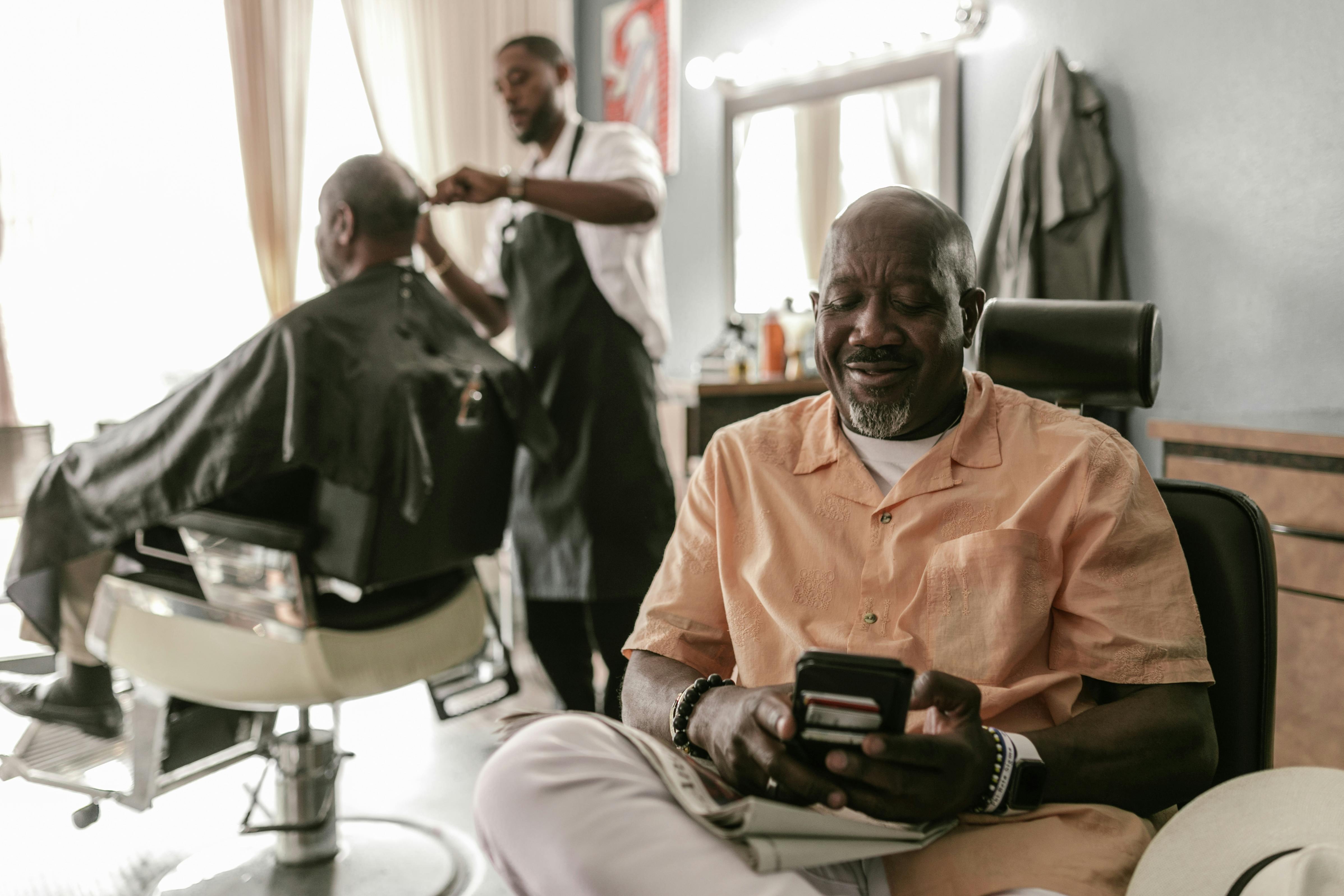 a man sitting on a barber chair