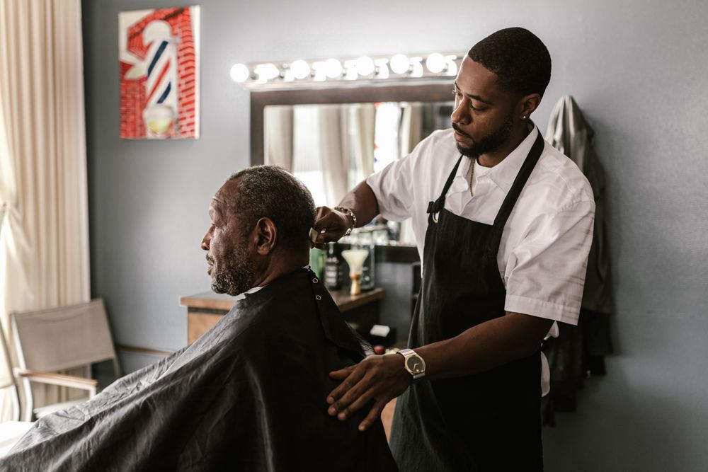 Barber talking through the cut with a client