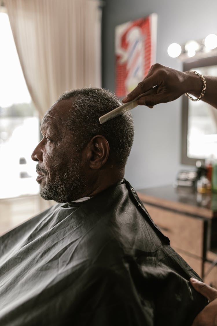 Combing An Elderly Man's Hair