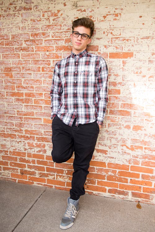 Free Man Wearing Red And White Plaid Dress Shirt And Black Pants Stock Photo