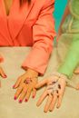 Person in Pink Long Sleeve Shirt With Butterfly Tattoo on Left Hand