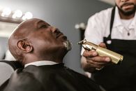Person Holding a Gold Razor