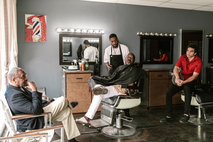 Barber serving a client in a barbershop