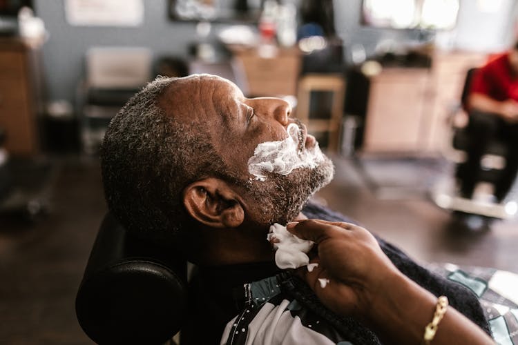 A Man With Shaving Cream On His Face