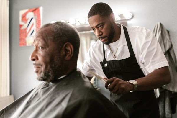 Barbershop chair and client