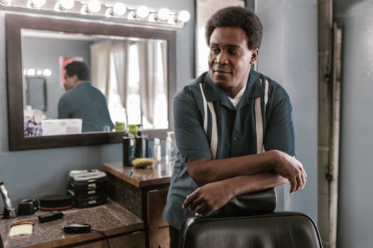 Man leaning on a chair in a classic barber shop setting. Retro style.