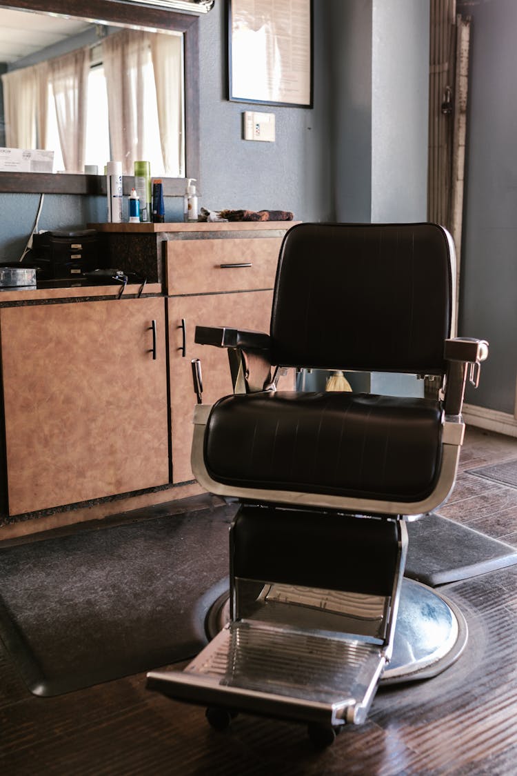 A Black Leather Barber Chair