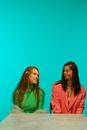 2 Woman in Green and Pink Jackets