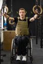 Man in Black and Brown Long Sleeve Shirt Sitting on Black Wheelchair
