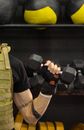 Man in Black T-shirt Carrying Black Dumbbell