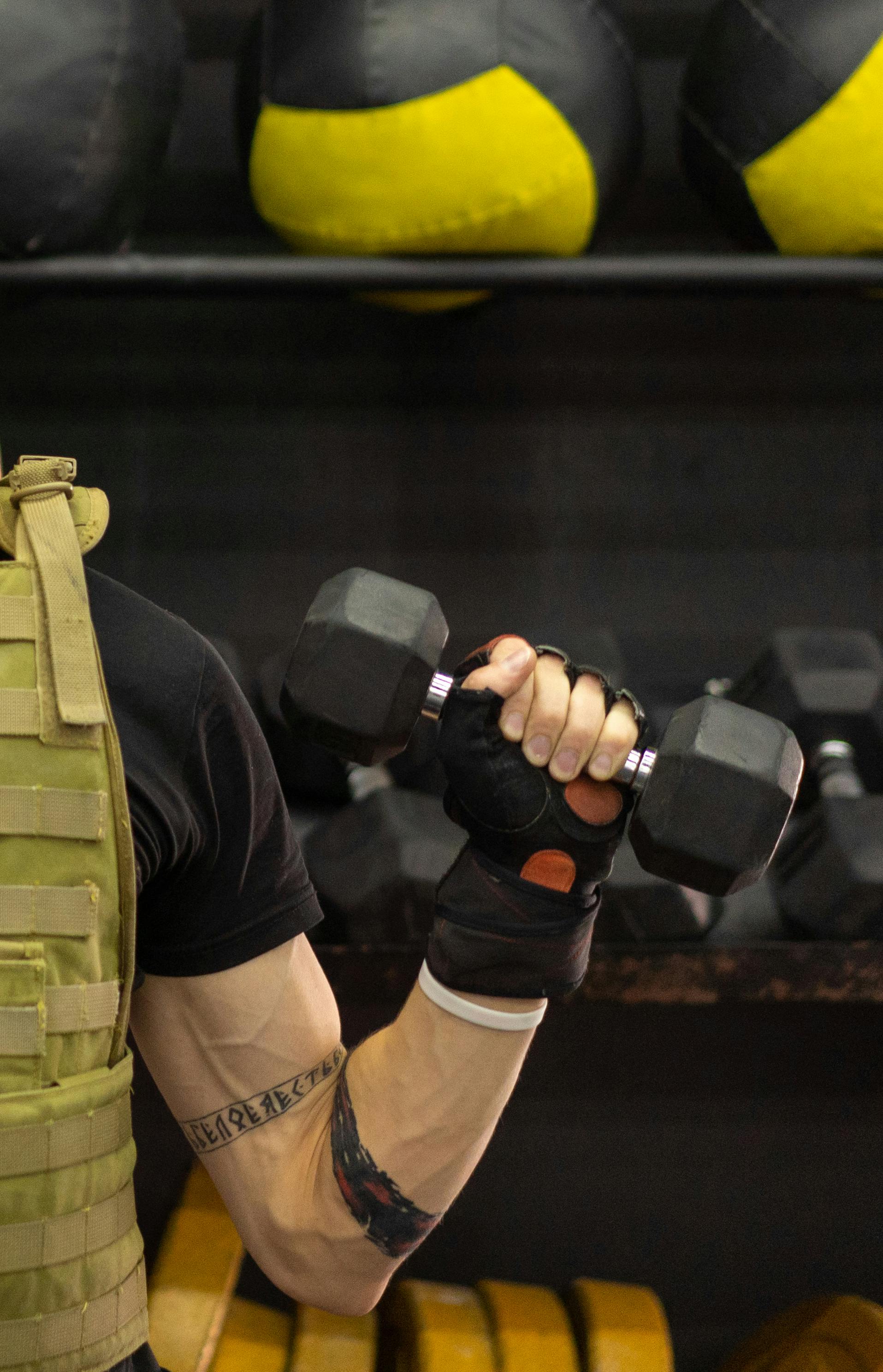 A Man Lifting Dumbbell while Wearing Virtual Goggles · Free Stock