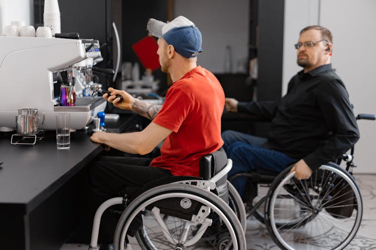 People In Wheelchair Working In A Coffee Shop