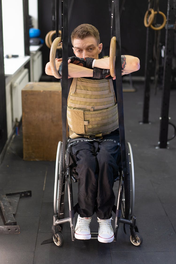 A Man In The Wheelchair Inside A Gym