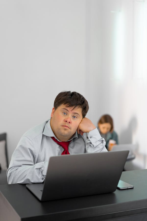 Man in Gray Dress Shirt Using Laptop Computer