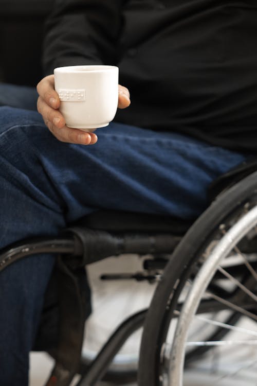 A Person Holding a Cup of Coffee