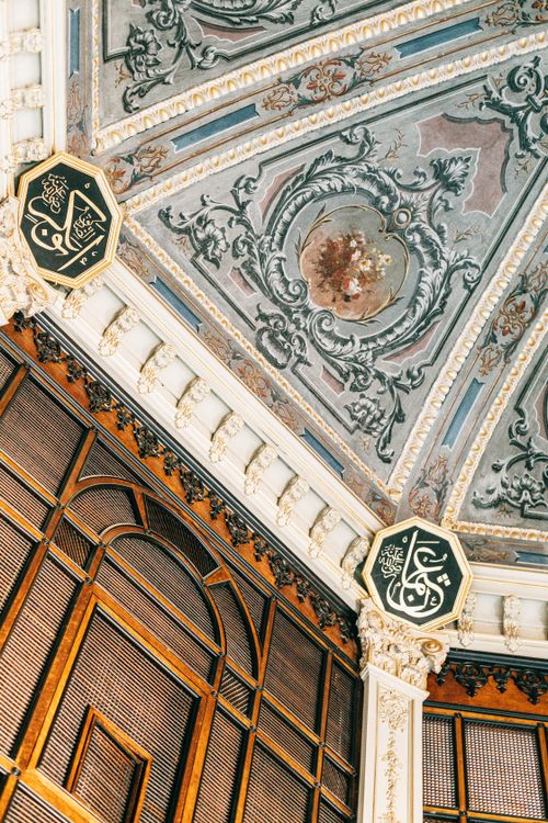 Free Ornate Islamic design on a beautifully detailed interior ceiling captured from a low angle. Stock Photo